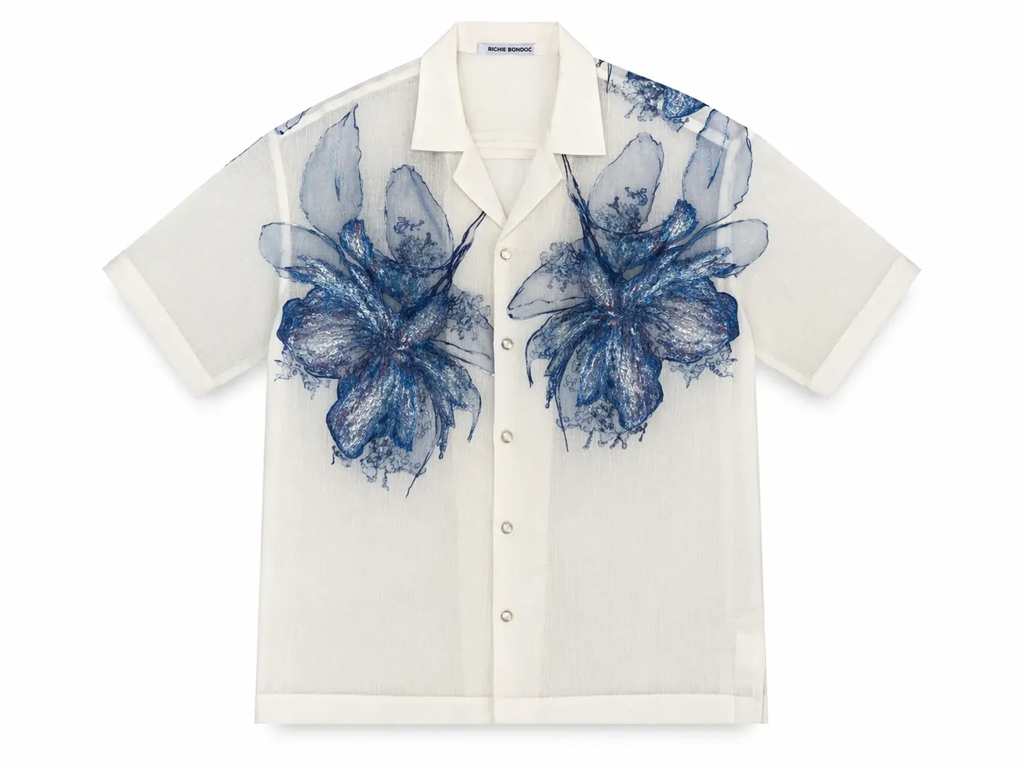 Front of a cream modern Barong by Richie Bondoc with blue floral detailing